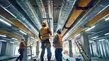 construction-workers-inspecting-hvac-installation-commercial-building_936494-1683.avif
