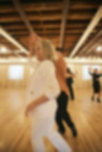 expert instructor working one on one with adult dance partner