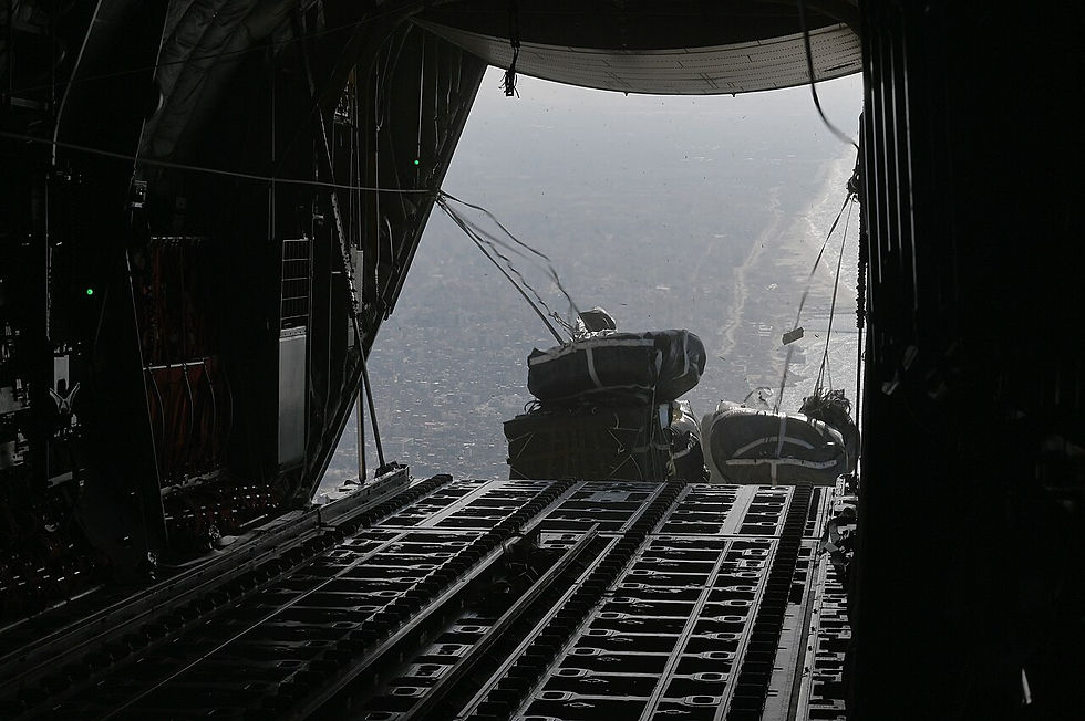A U.S. Air Force C-130J Super Hercules conducts an airdrop of humanitarian assistance over Gaza, Mar. 11, 2024. (Image: Wikimedia Commons). Aid Agencies in Gaza.
