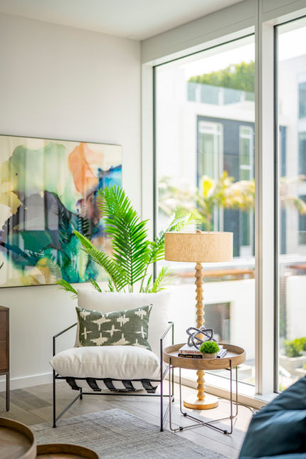 The Apartment Designer, Four Seasons Residency in Beverly Hills, California. Accent chair with colorful art and lamp.
