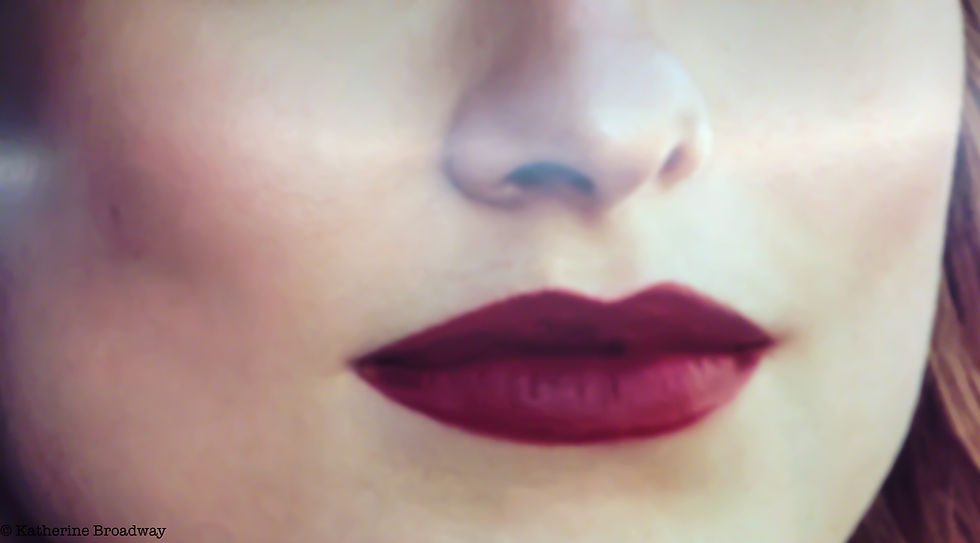 Image of female face with focus on dark red lips. Raleigh Psychotherapy, counseling, selfish, Broadway