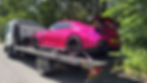 Pink sports car on a flatbed for vehicle recovery Edinburgh