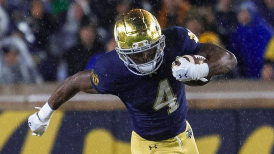 Jeremiyah Love scampers