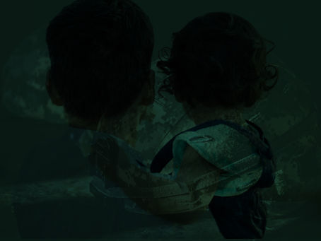 Silhouettes of father and toddler overlaid on army helmets