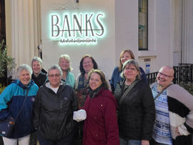 Travel group standing in front of Banks Mansion