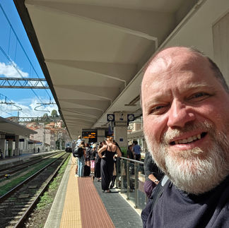 Chris smiling on the train station