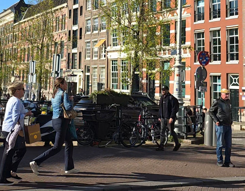 People walking around an Amsterdam street