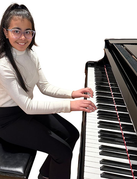 Teen learning piano at Scotia Suzuki School in Halifax