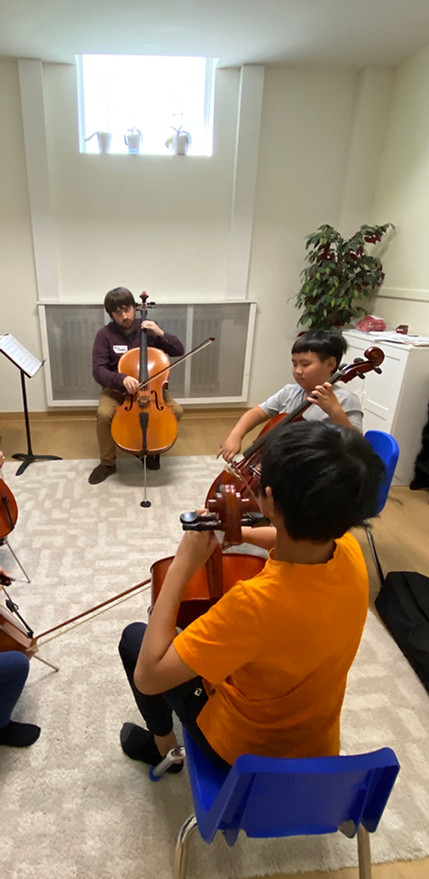 Teen learning cello at Scotia Suzuki School in Halifax