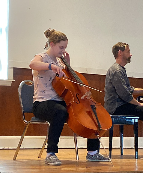 Adult learning cello at Scotia Suzuki School in Halifax