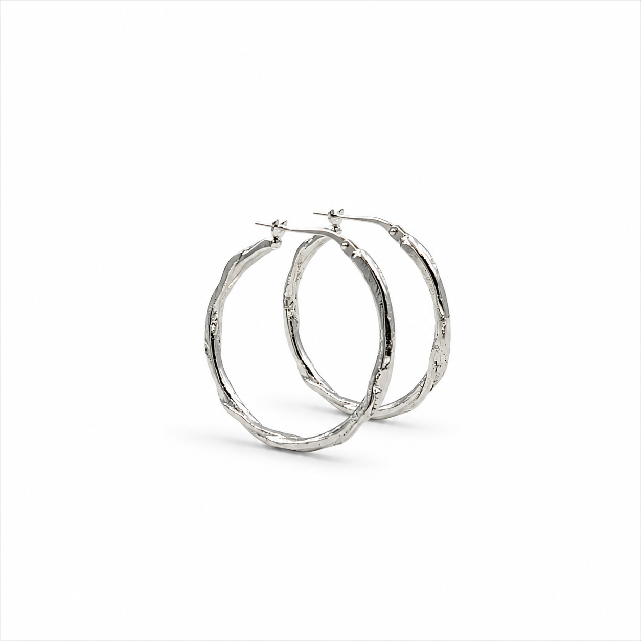 Boucles d'oreilles créoles en argent fusionnées