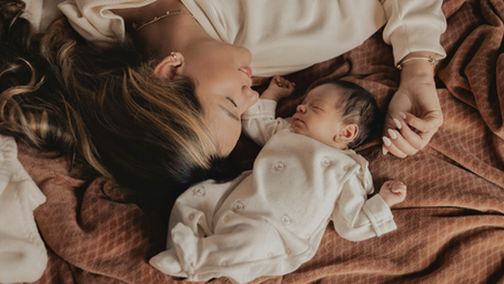 A free verse poem about the complicated emotions of breastfeeding and early motherhood. The speaker describes late-night nursing while eating peanut butter and crackers, physical pain, the intimacy of feeding her baby, outside pressure surrounding breastfeeding, and her desire to savor the quiet moments alone with her child. The poem ends with the speaker wondering whether the wet crumbs she wipes away are soggy crackers or tears.