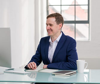 Group Excel training session with laptops