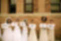 An image of brides wearing wedding dresses and holding signs that say "In the nick of time"