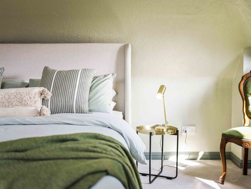 The Loft, Master Bedroom in Green, designed by Olive and Wilde Interiors, a studio for AirBnB and STR hosts based in Weymouth Dorset but with a worldwide portfolio