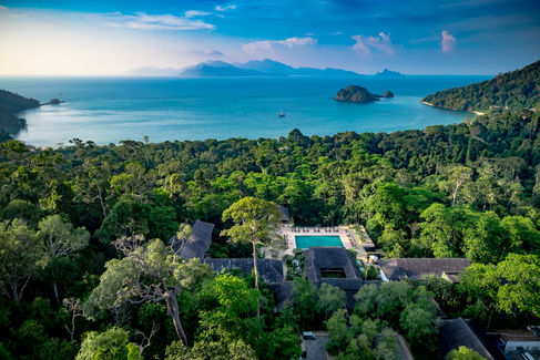 Aerial view of Capella Taipei resort nestled in lush greenery overlooking ocean