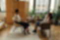Client speaking with her therapist during a session in a modern counseling office.jpg