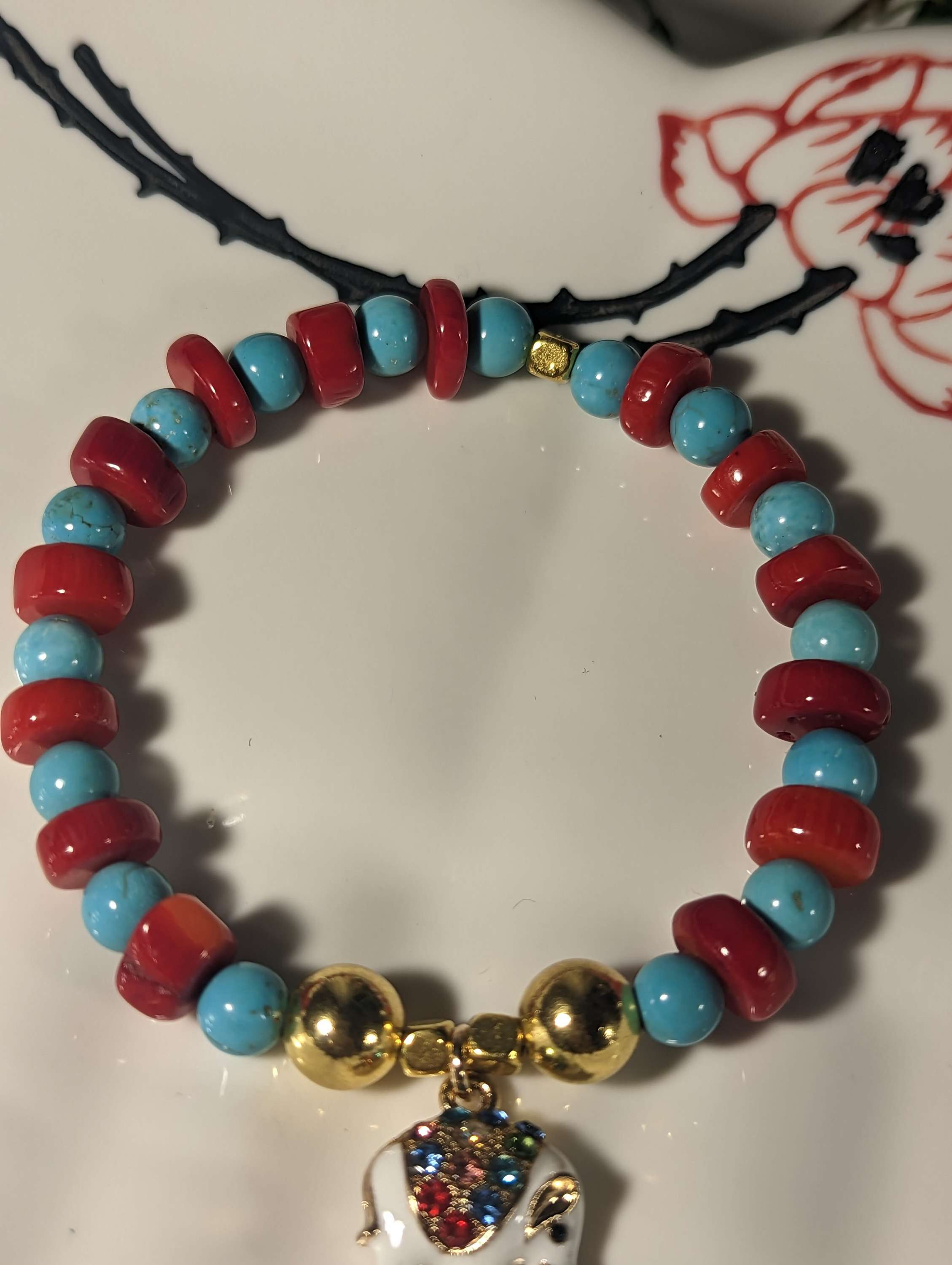 Turquoise and red bamboo coral lucky elephant bracelet 