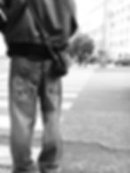 Black and white shot of someone from behind wearing interesting jeans