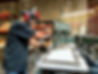 R&S Wholesale Doors cutting a window in a garage door