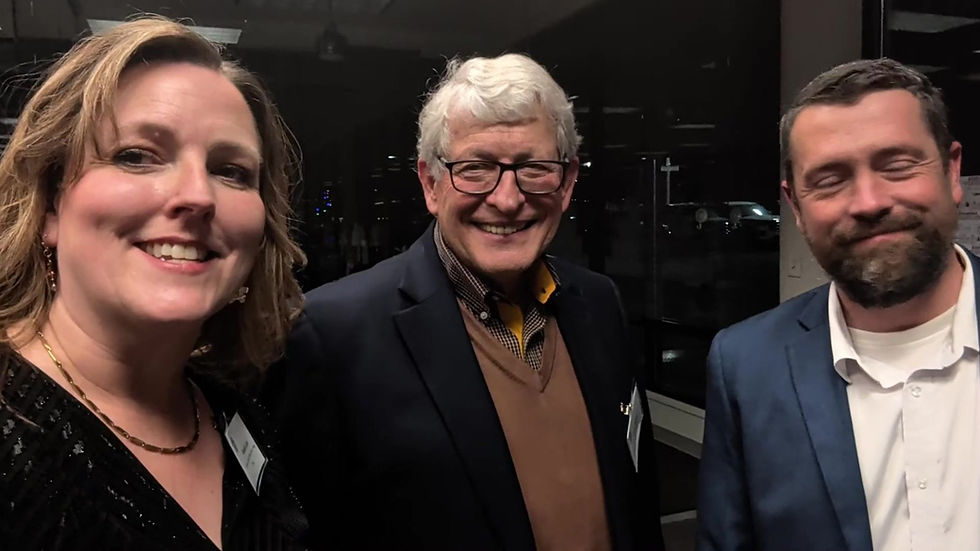 Chair Natalie Levi with two guests at an evening event