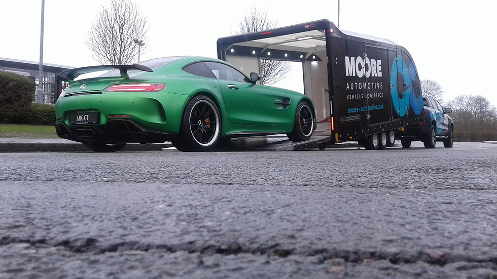 A luxuary sports car going into our enclosed trailer for our covered car transport service in the UK