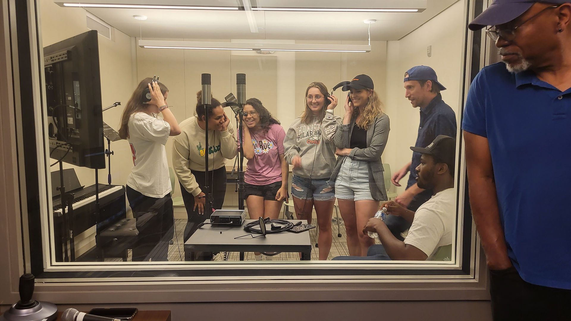 group in the vocal booth