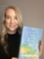 Dr Marianne holding Grief Collective book