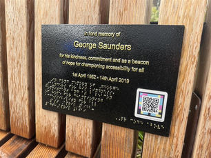 Memorial Plaque for George Saunders mounted with wording in braille and a QR code