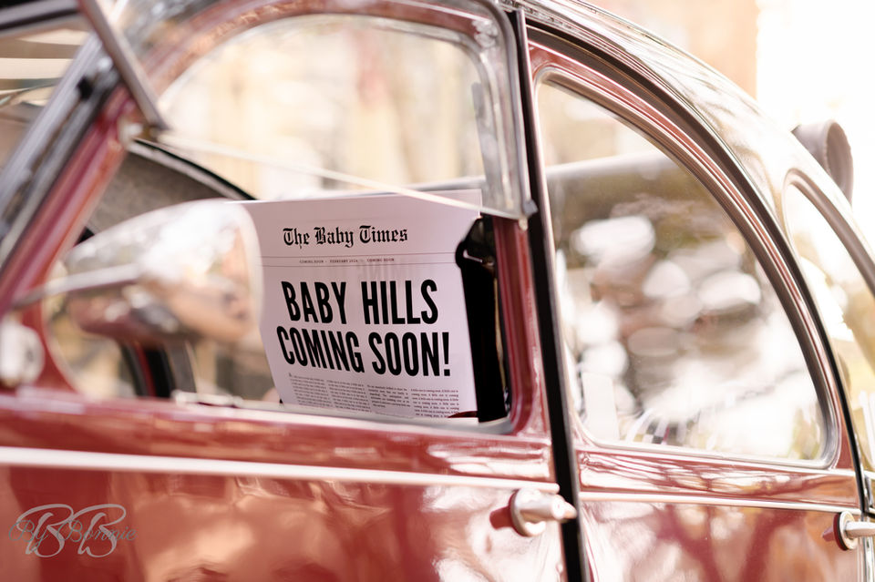 vintage car and newspaper baby announcement 
