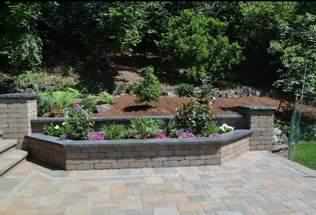 Retaining wall planter with paver patio terrace and garden beds in Kent, WA