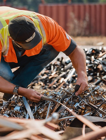 person inspecting metal scrap.jpg