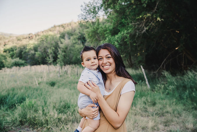 Owner, Nicole Peterson, holding her son
