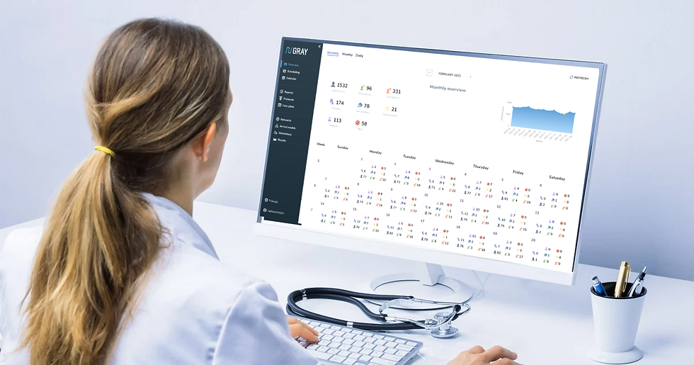 A healthcare professional uses GrayOS on a computer.