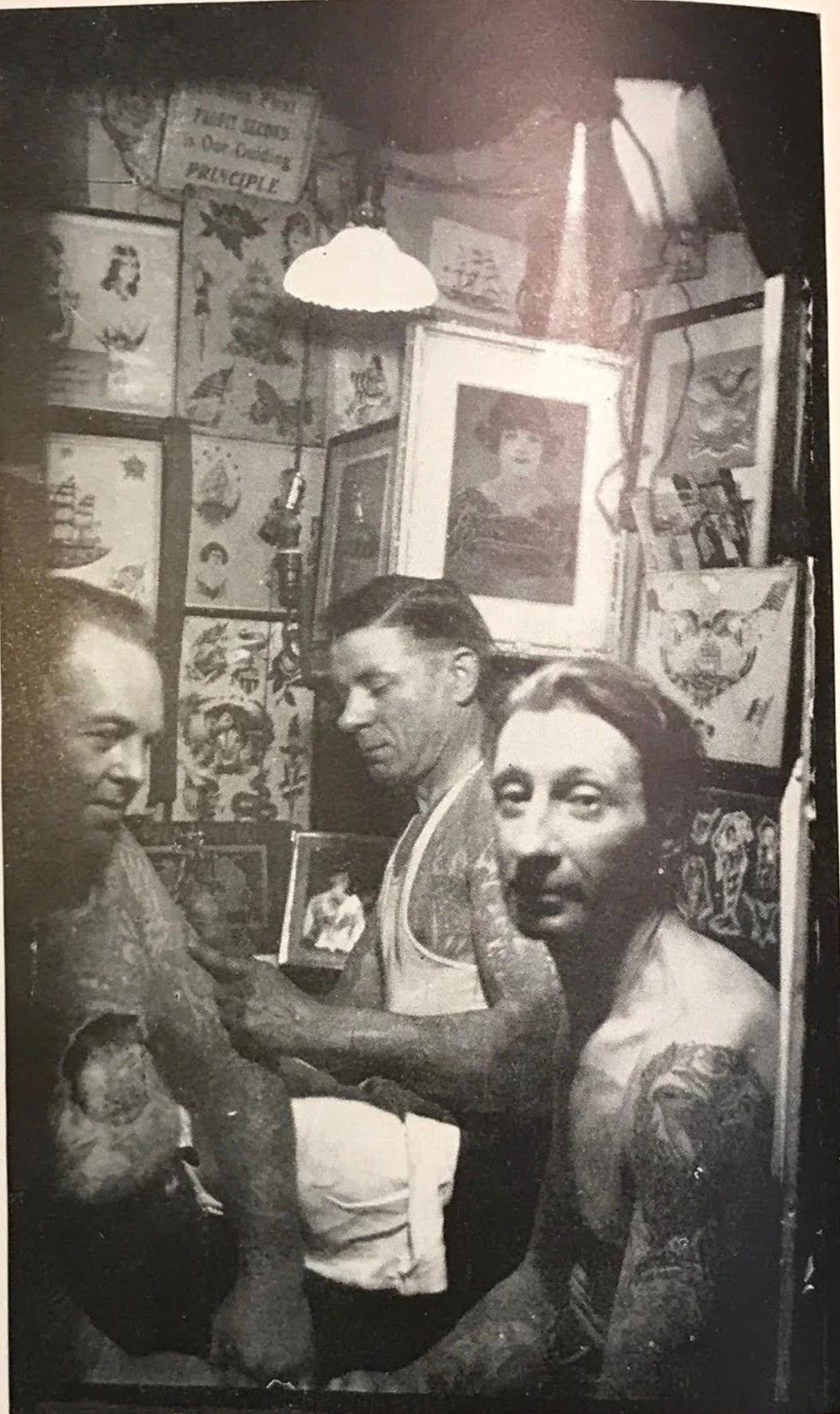 A Typical Tattoo-Shop Interior - Note the profusion of sample-signs on the walls.
