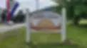 jhs-sign-with-open-flag.webp