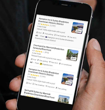 hand holding a smart phone with Bradenton Florida Google search results.