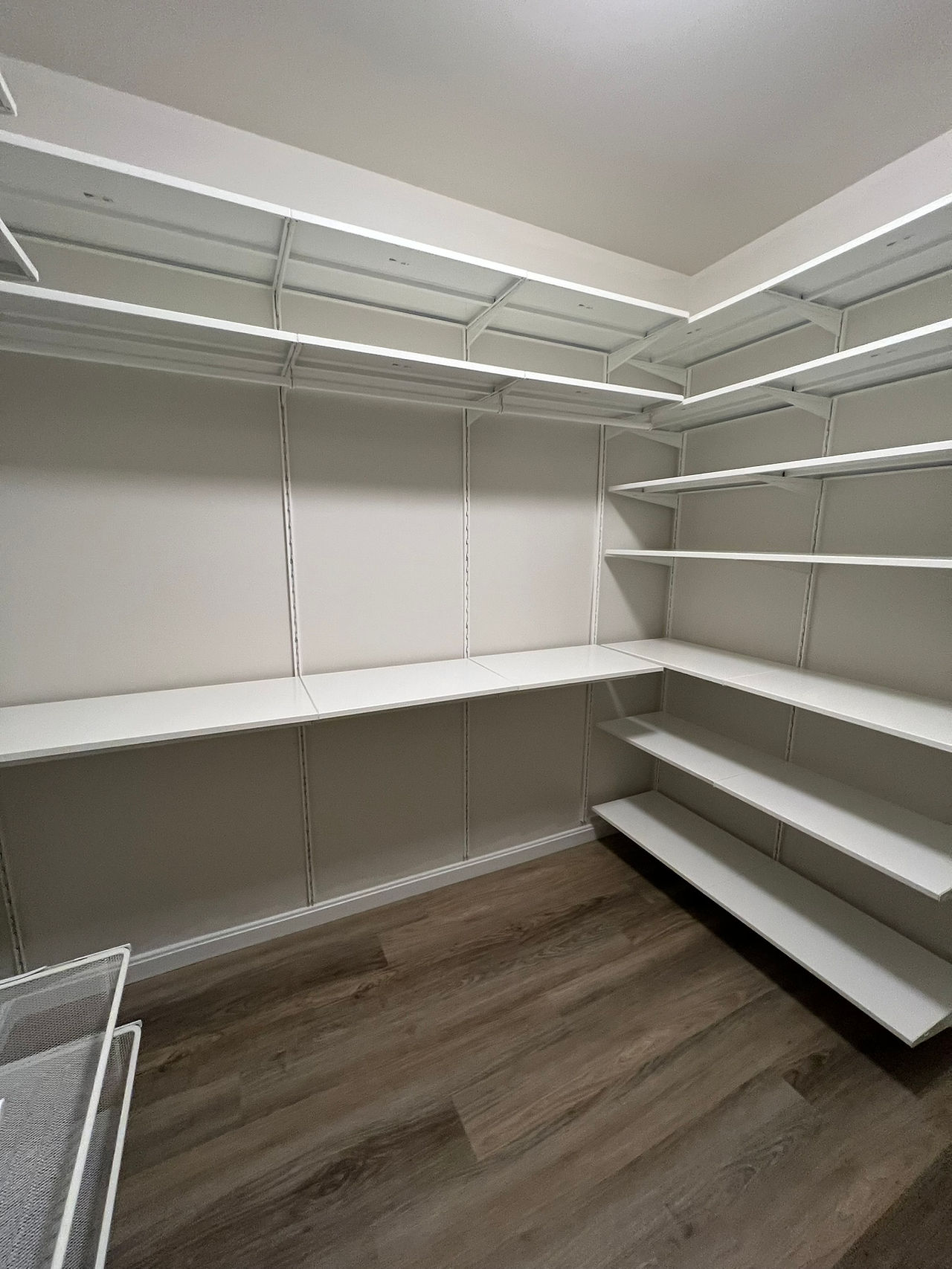 IKEA Boaxel Shelving System with Clothes Rails and Shelves Installed in Walk-in Closet