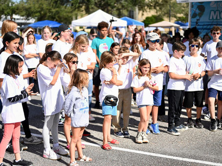 Young children gathering at the Brevard Children's Business Fair