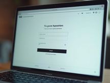 Simple email sign-up form on laptop screen