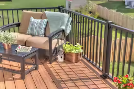 Eye-level view of a backyard deck showing different Trex composite decking lines side by side