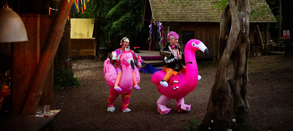 Candid documentary photo of funny, high-energy wedding guests at an outdoor festival wedding in Sussex.