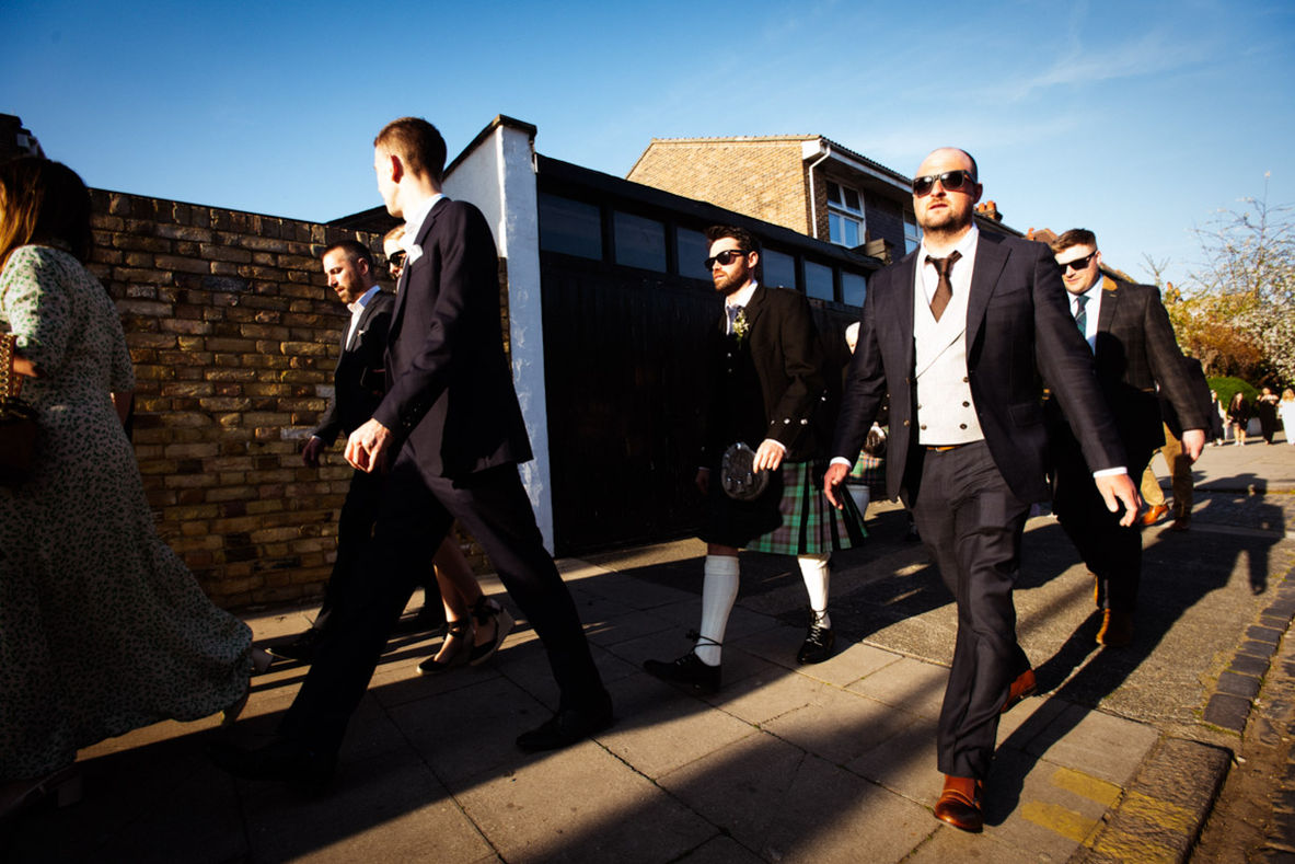 Wedding guests walking, sunny day