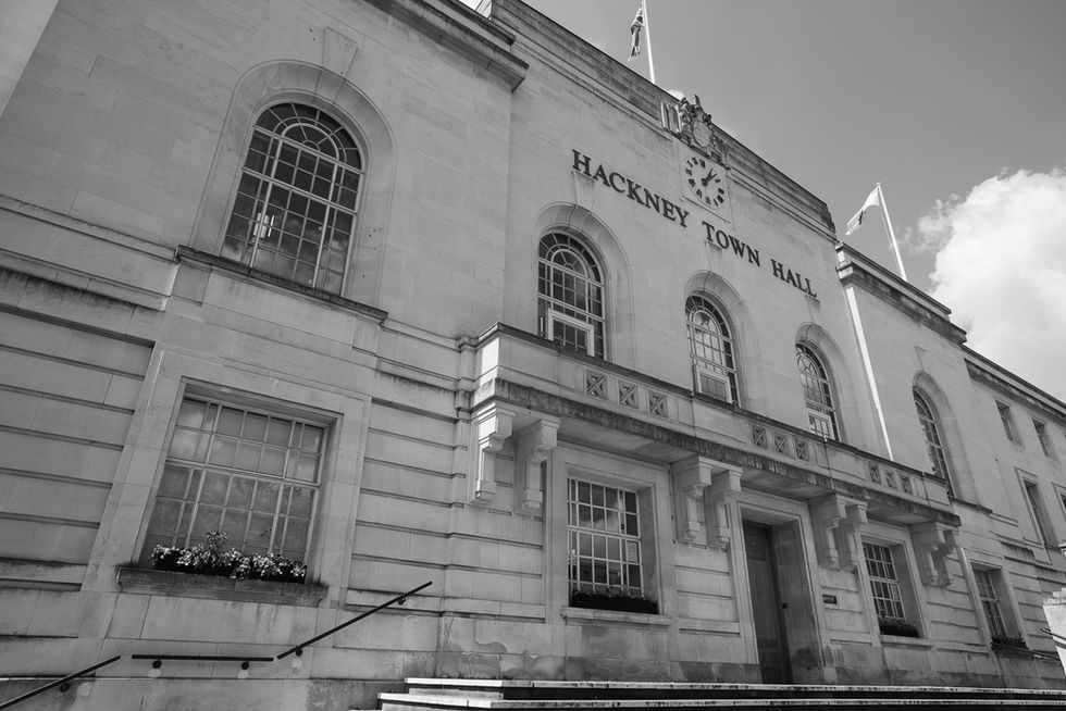 Black and white architectural wedding photography of the historic Hackney Town Hall facade in East London.