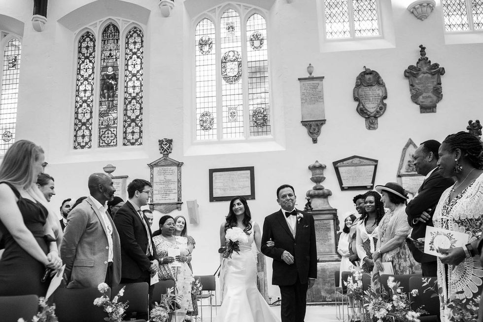 Bride and father walking down aisle