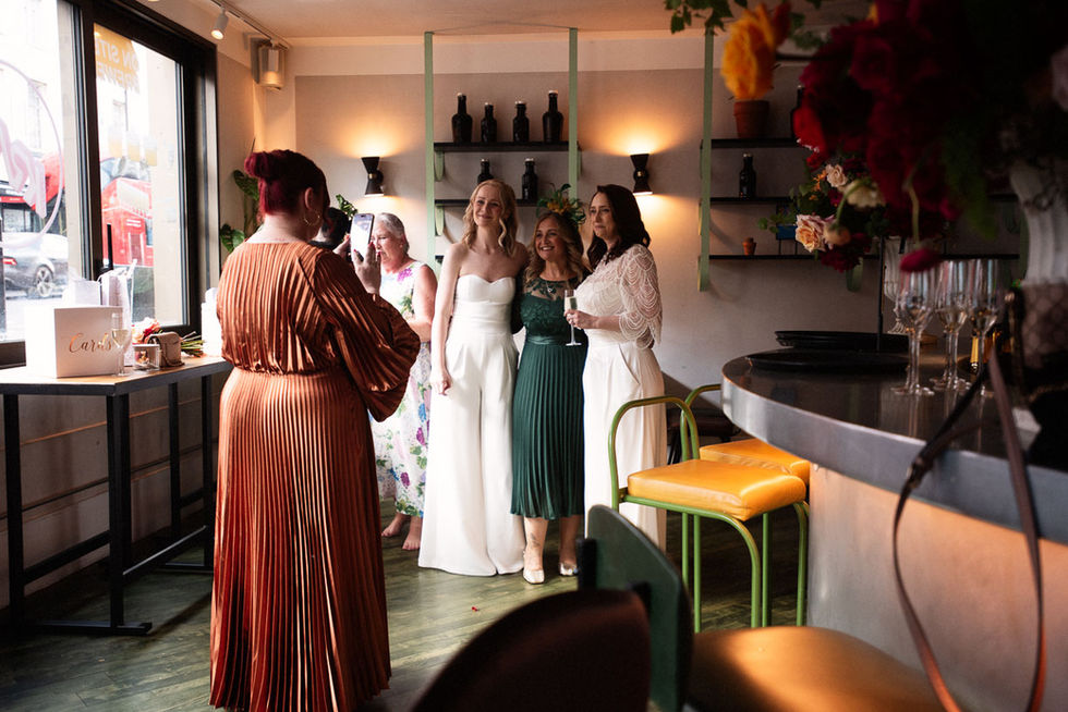 Bride with bridesmaids posing for a photo