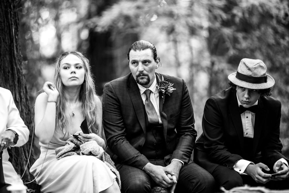 Wedding guests seated at outdoor ceremony