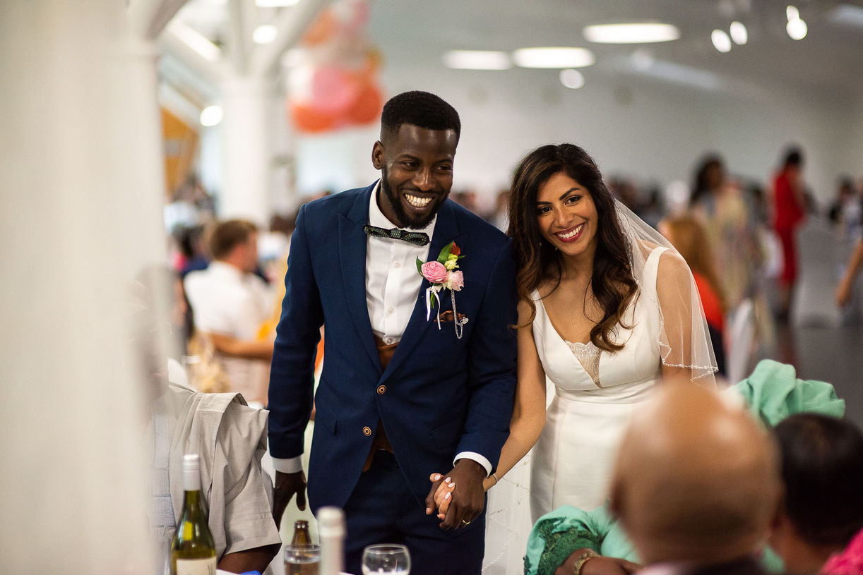 Happy wedding couple holding hands