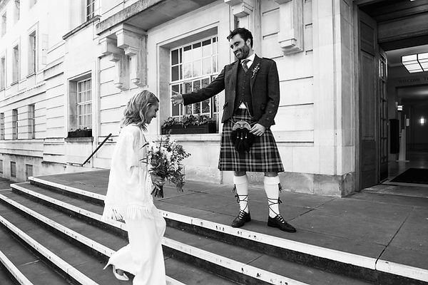 Documentary wedding photography outside the iconic steps of Hackney Town Hall registry office.
