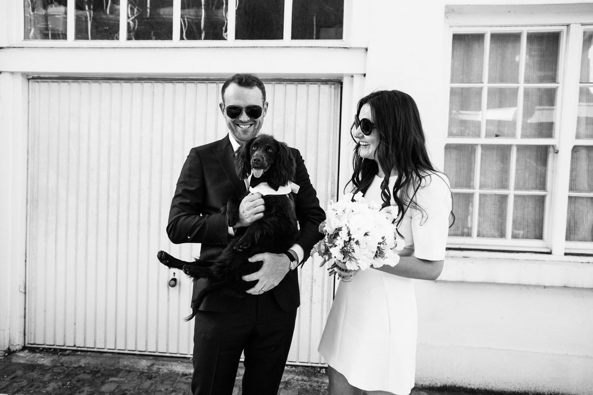 Happy couple with dog, black and white photo